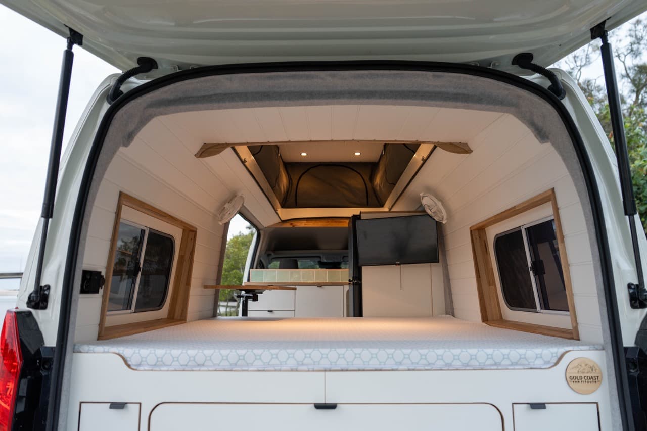 Gary & Jen’s SLWB Toyota Hiace, rear doors open on the bed and kitchen